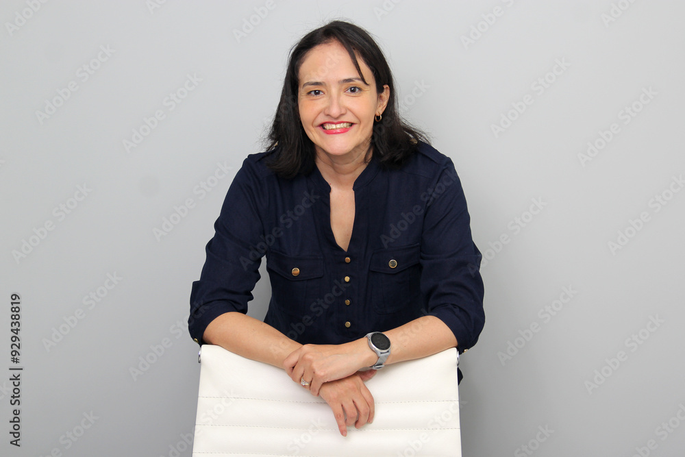 40-year-old executive woman in her office chair shows her leadership, power and innovation in her company 40-year-old executive woman in her office chair shows her leadership, power and innovation in her company