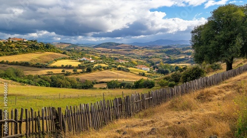 Rural Landscape with Rolling Hills and a Wooden Fence