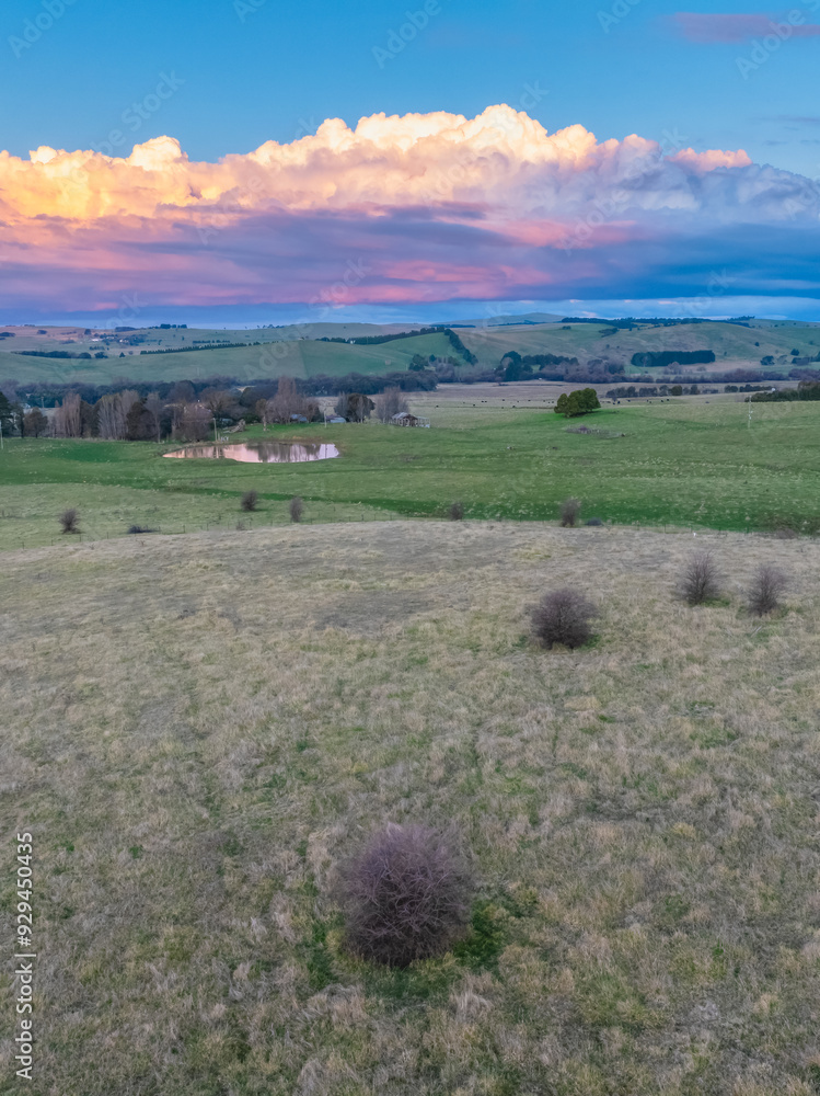 Fototapeta premium Sunset views over rural farmland with clouds