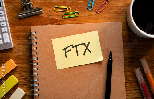 There is sticky note with the word FTX. It is an abbreviation for FTX as eye-catching image. photo