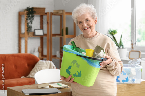 Senior woman with garbage b...