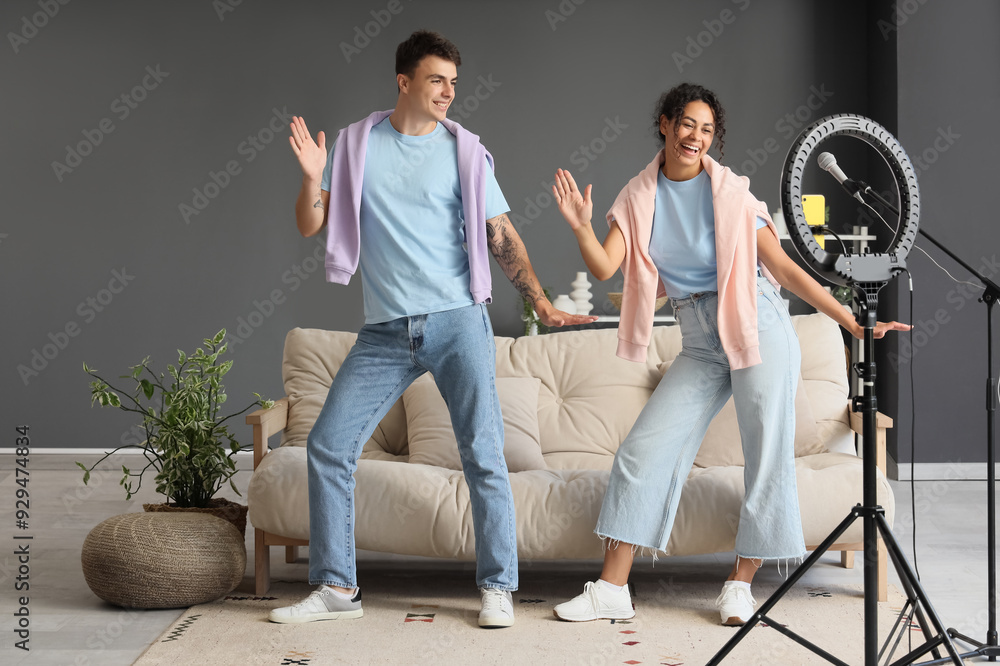 Couple of bloggers dancing while recording video at home Couple of bloggers dancing while recording video at home