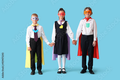Happy pupils dressed as sup...