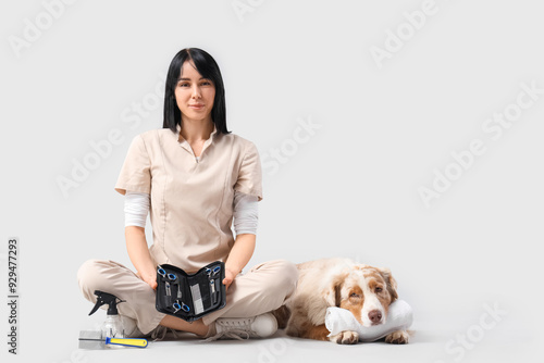 Female groomer with scissor...