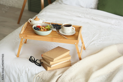 Tray with breakfast, books ...