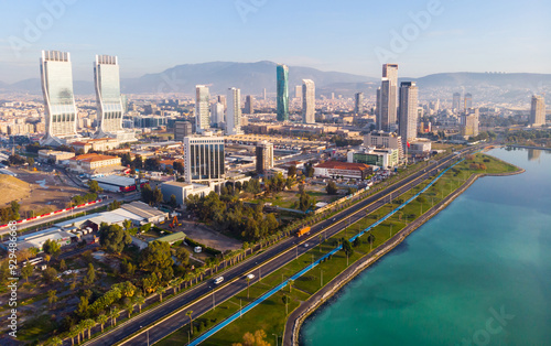 Fotografie Scenic aerial view of modern cityscape of Izmir along shoreline of Aegean Sea on