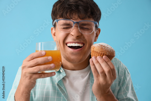 Happy young man with tasty ...