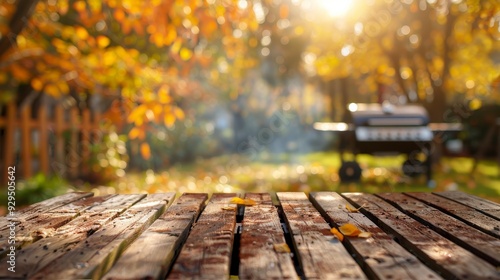 Wallpaper Mural A serene outdoor scene with autumn leaves and a barbecue grill in the background. Torontodigital.ca