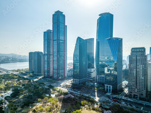 Yeouido, Yeongdeungpo-gu, Seoul, South Korea - April 11, 2022: Aerial and morning view of Yeouido Park and Seoul International Finance Center with Park One Building against Han River photo