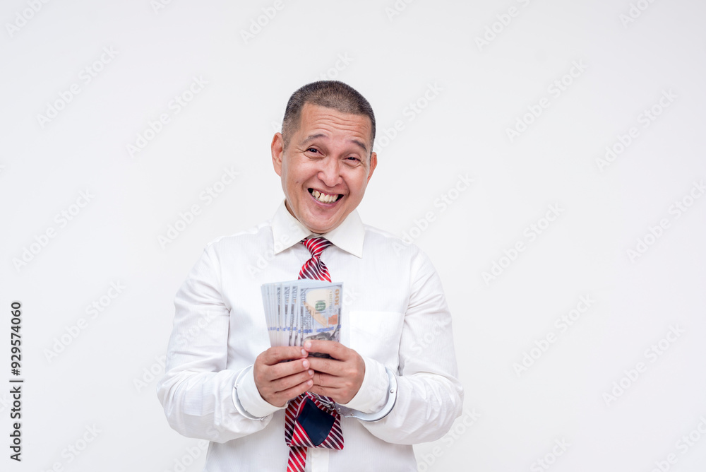 A middle aged professional or manager under arrest and in handcuffs, holding dollar bills. Concept of bail money or bribery to avoid being convicted. Isolated on a white background. A middle aged professional or manager under arrest and in handcuffs, holding dollar bills. Concept of bail money or bribery to avoid being convicted. Isolated on a white background.
