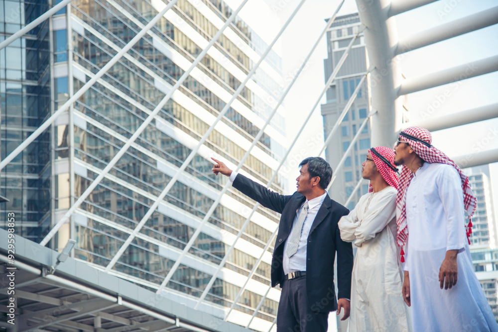 Arab muslim man team talking together UAE union teamwork people. United Arab Emirates diversity group of people discuss consulting modern muslim city. Portrait Happy Entrepreneur manager smile team Arab muslim man team talking together UAE union teamwork people. United Arab Emirates diversity group of people discuss consulting modern muslim city. Portrait Happy Entrepreneur manager smile team