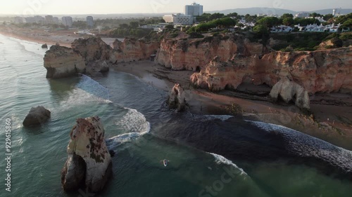 The Magic of Golden Hour at Three Brothers Beach (Praia dos Três Irmãos), Algarve, Portugal. photo