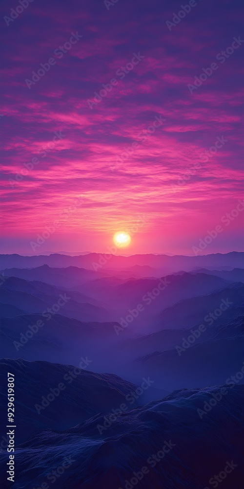 Fototapeta premium A breathtaking sunrise paints the sky with vibrant hues of pink and purple as the sun peeks over a distant mountain range.