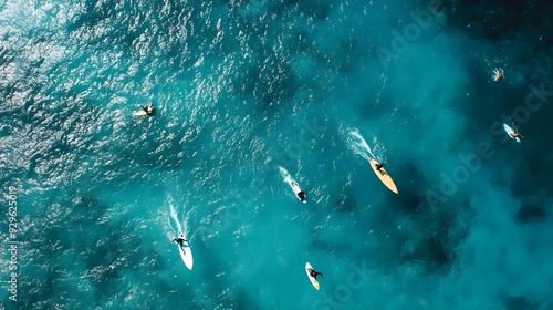 Top view drone shot of surfers paddling