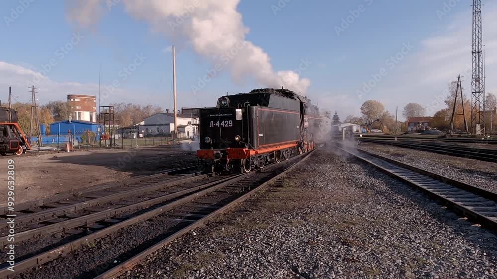 Old Soviet steam locomotive on an October morning, Karelia, Russia Old Soviet steam locomotive on an October morning, Karelia, Russia