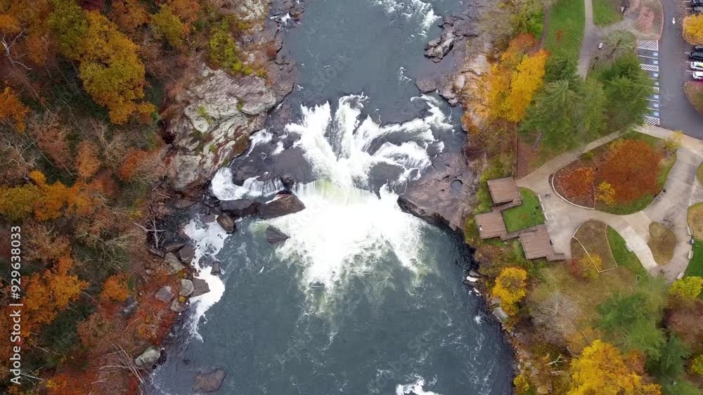 Ohiopyle waterfall aerial view. Aerial view of the Ohiopyle Falls in the Fall. Ohiopyle State Park in Pennsylvania on the Youghiogheny river in fall. Youghiogheny River as it cuts through forest Ohiopyle waterfall aerial view. Aerial view of the Ohiopyle Falls in the Fall. Ohiopyle State Park in Pennsylvania on the Youghiogheny river in fall. Youghiogheny River as it cuts through forest