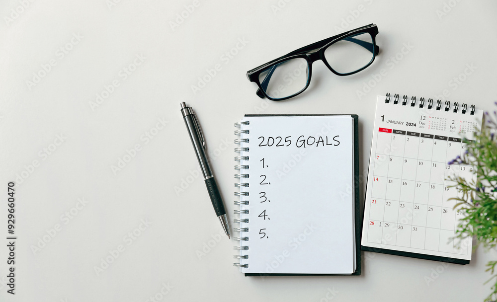 2025 New Year goal, plan, and action concepts. 2025 goals Text on Note Pad with calendar, glasses on the table.New Year's resolutions plan.Happy New Year theme, top view, copy space. 2025 New Year goal, plan, and action concepts. 2025 goals Text on Note Pad with calendar, glasses on the table.New Year's resolutions plan.Happy New Year theme, top view, copy space.