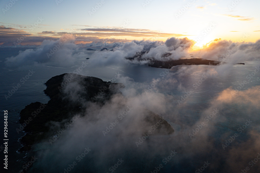 Obraz premium Aerial view above Tavewa Island in the Yasawa Islands Fiji at sunrise - Tropical paradise Island in the south Pacific 