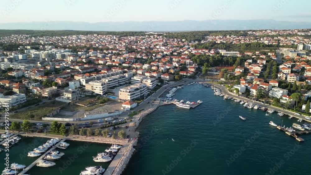 Zadar in sunset, cityscape aerial slide panorama over houses, Adriatic Sea and marina Vitrenjak. Croatia sailing destination Zadar in sunset, cityscape aerial slide panorama over houses, Adriatic Sea and marina Vitrenjak. Croatia sailing destination
