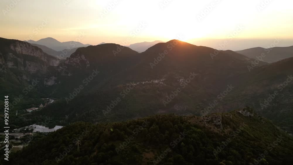 A stunning drone view of Frasassi Gorge, Italy, at sunset. Golden light bathes the cliffs and river, creating a serene, awe-inspiring landscape as the day fades into a warm, tranquil evening. A stunning drone view of Frasassi Gorge, Italy, at sunset. Golden light bathes the cliffs and river, creating a serene, awe-inspiring landscape as the day fades into a warm, tranquil evening.