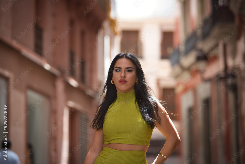 Portrait of young, beautiful, brunette, Latina woman, wearing a green suit, posing as a successful, free and independent woman. Concept beauty, fashion, trend, city. Portrait of young, beautiful, brunette, Latina woman, wearing a green suit, posing as a successful, free and independent woman. Concept beauty, fashion, trend, city.
