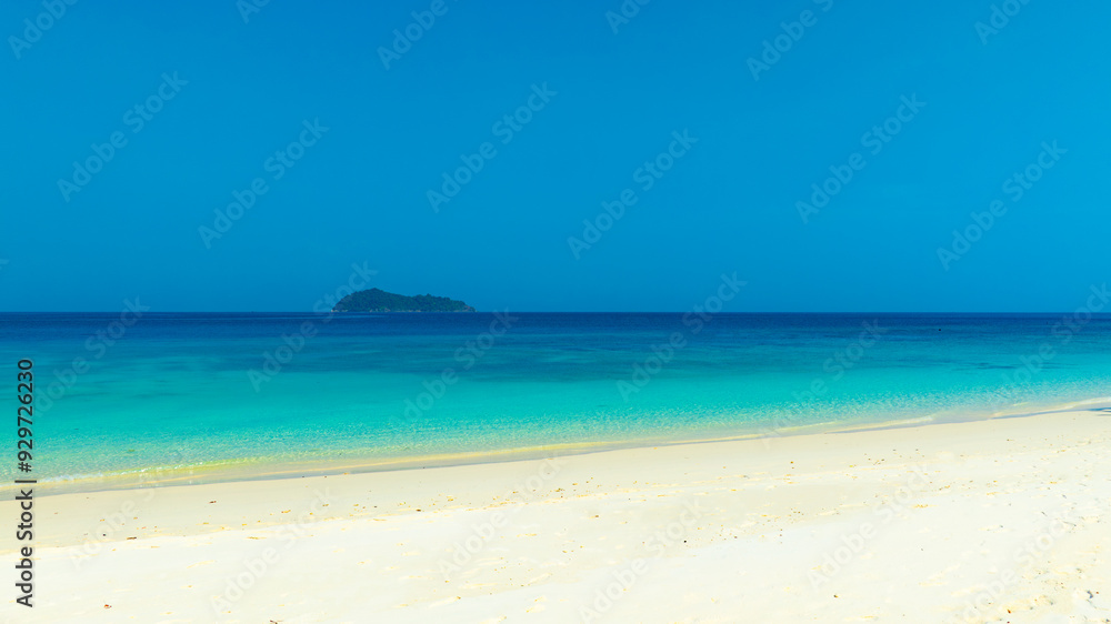 Nature of the beach and sea Summer with sunshine, sandy beaches, clear blue waters sparkling against the blue sky. On an island with good ecology and environment Background for summer vacation concept Nature of the beach and sea Summer with sunshine, sandy beaches, clear blue waters sparkling against the blue sky. On an island with good ecology and environment Background for summer vacation concept
