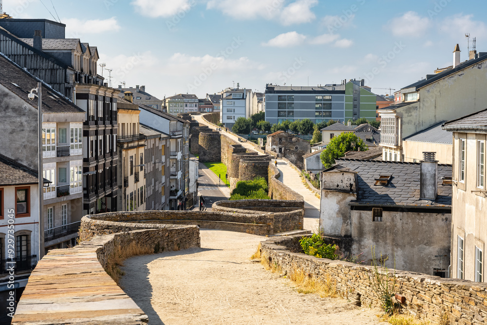 Path over the wall of Roman origin where people walk in the monumental city of Lugo, Galicia. Path over the wall of Roman origin where people walk in the monumental city of Lugo, Galicia.