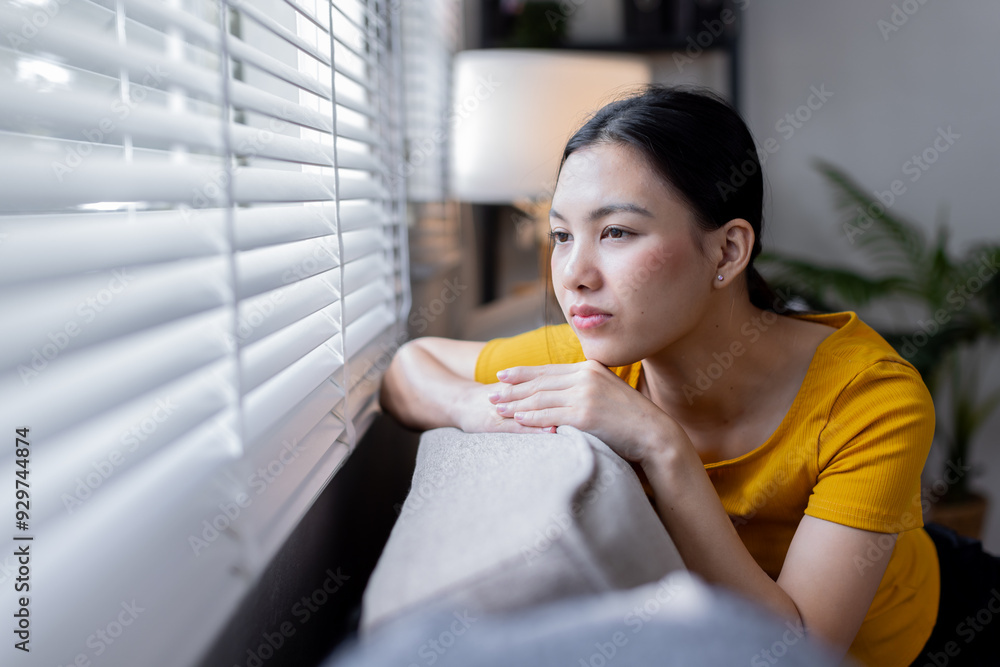Smiling asain girl sit on comfortable couch look in window dreaming thinking of future resting in living room, Smiling asain girl sit on comfortable couch look in window dreaming thinking of future resting in living room,