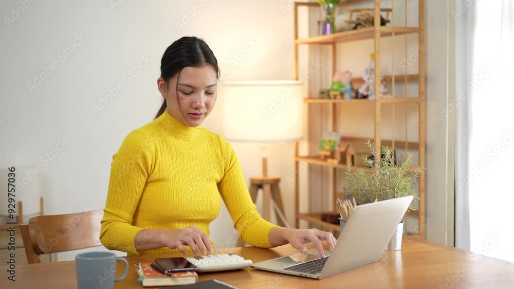 Business woman calculate tax, income and expenses, hand holding bills of credit card for payment or payday on table at home office. Financial, finance at home concept. Business woman calculate tax, income and expenses, hand holding bills of credit card for payment or payday on table at home office. Financial, finance at home concept.