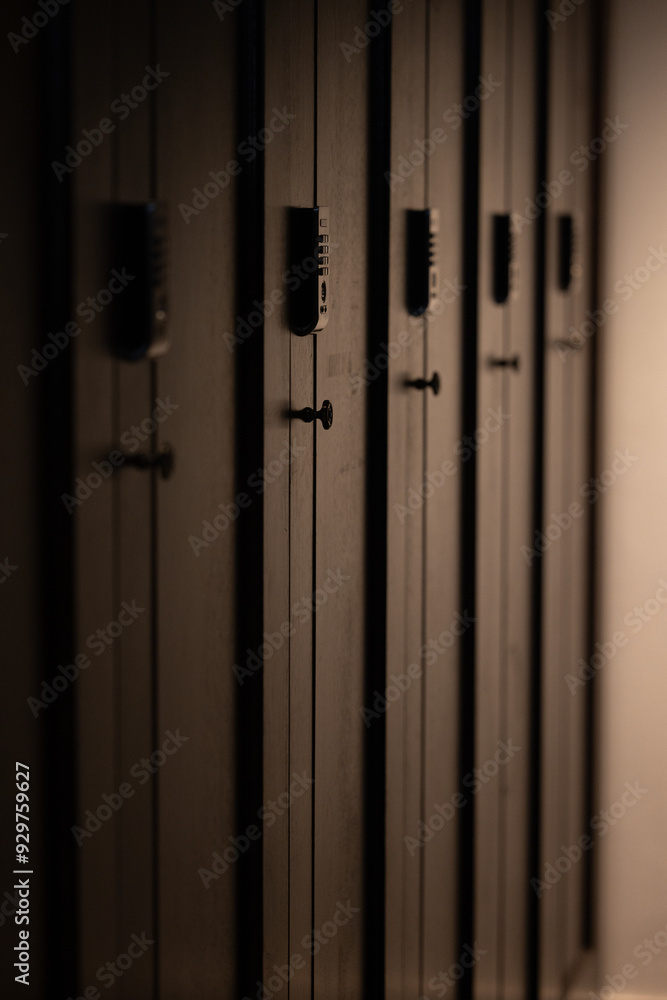 Modern electronic combination locks in an ultra-modern sports club in a big city. Storing things in a locker before a fitness workout. Pilates room. Locker room for athletes in a big city. Sports. Modern electronic combination locks in an ultra-modern sports club in a big city. Storing things in a locker before a fitness workout. Pilates room. Locker room for athletes in a big city. Sports.