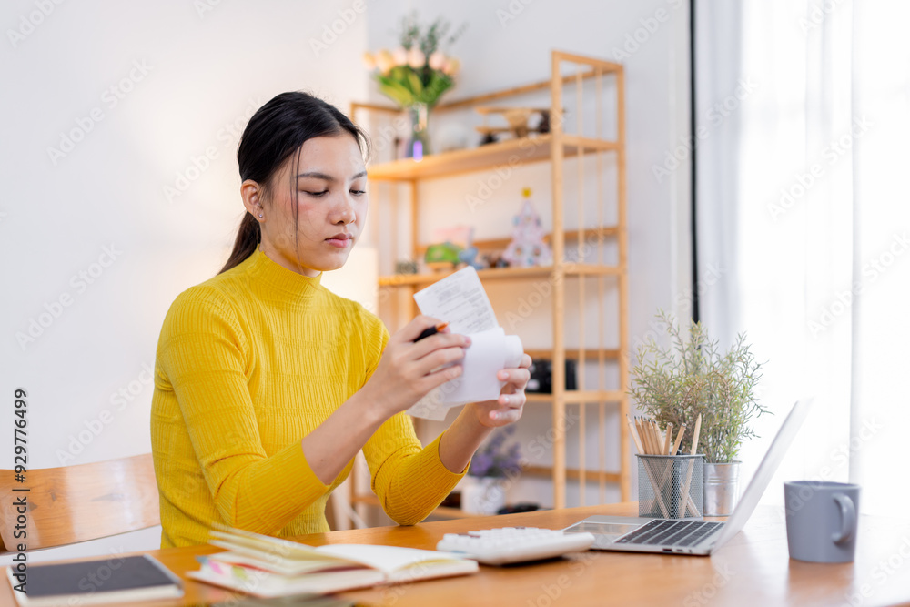 Stressed young asian woman calculating monthly home expenses, tax, bank account balance and credit card bills payment, Income is not enough for expenses. Stressed young asian woman calculating monthly home expenses, tax, bank account balance and credit card bills payment, Income is not enough for expenses.