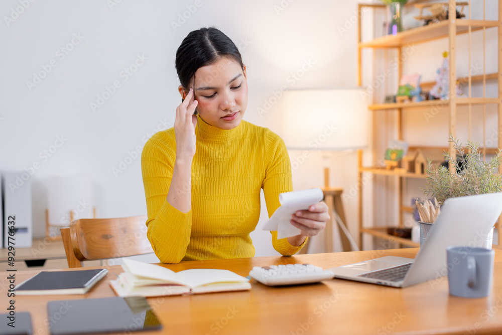 Stressed young asian woman calculating monthly home expenses, tax, bank account balance and credit card bills payment, Income is not enough for expenses. Stressed young asian woman calculating monthly home expenses, tax, bank account balance and credit card bills payment, Income is not enough for expenses.