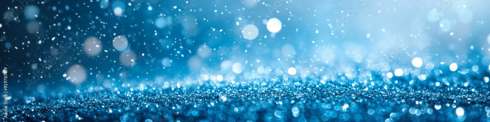 Glittering blue droplets shimmer on a rainy day with soft bokeh in the background Glittering blue droplets shimmer on a rainy day with soft bokeh in the background