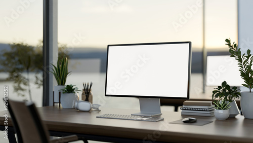 Wallpaper Mural A computer desk in a modern office surrounded by large windows with a lake view, a computer mockup Torontodigital.ca