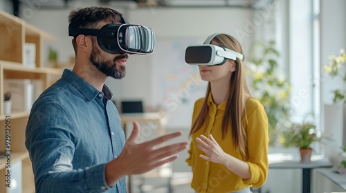 Two people using virtual reality headsets in a modern office setting.