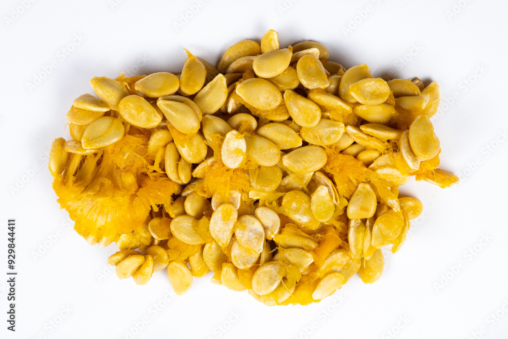 Raw seeds from fresh hokkaido pumpkin on a white background Raw seeds from fresh hokkaido pumpkin on a white background