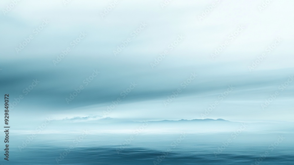 Obraz premium A blue sky with a few clouds and a body of water