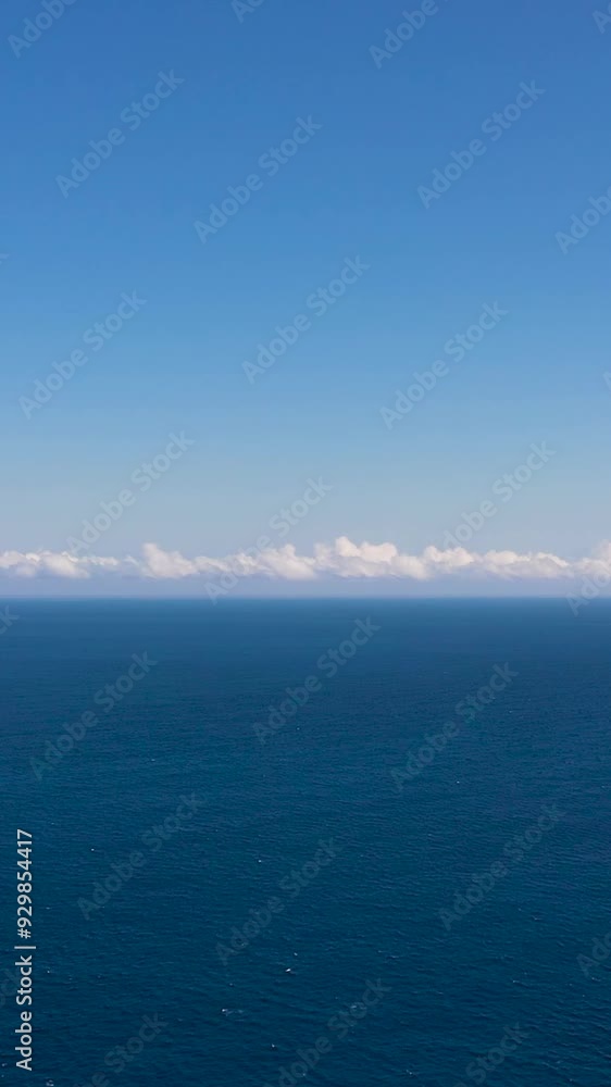 Open blue ocean with waves against the sky and clouds, top view. Open blue ocean with waves against the sky and clouds, top view.