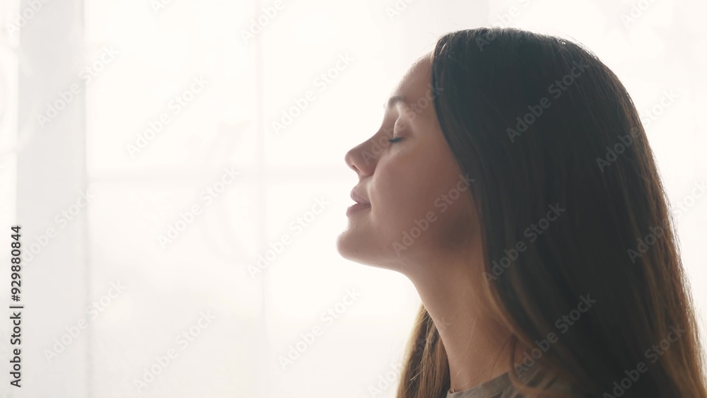 girl on a white background looks to the side. beauty dream concept. woman closes her eyes she dreams. the girl smiles, shows her teeth, she thinks about her wonderful future lifestyle girl on a white background looks to the side. beauty dream concept. woman closes her eyes she dreams. the girl smiles, shows her teeth, she thinks about her wonderful future lifestyle