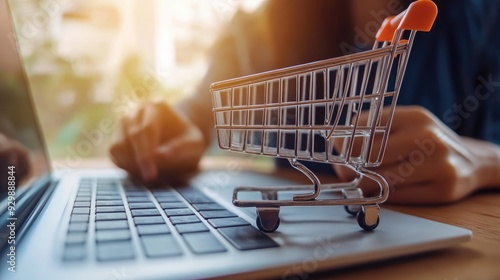 Online Shopping on Laptop with Miniature Shopping Cart