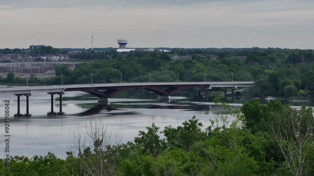 Aerial view of Waaban Crossing bridge over Great Cataraqui River flowing to St. Lawrence River in Kingston Ontario Limestone City Canada with cityscape background Aerial view of Waaban Crossing bridge over Great Cataraqui River flowing to St. Lawrence River in Kingston Ontario Limestone City Canada with cityscape background