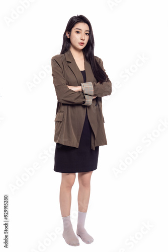 Young beautiful oriental woman in suit in front of white background White background