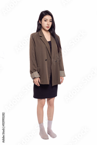 Young beautiful oriental woman in suit in front of white background White background