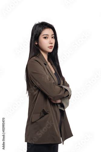 Young beautiful oriental woman in suit in front of white background White background
