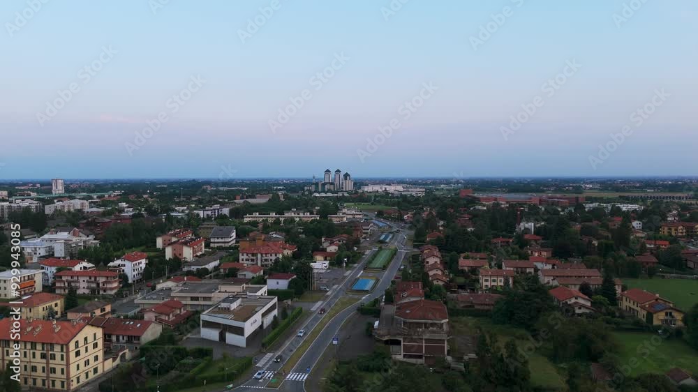 Vimercate suburban area at sunset Italy. Aerial ascending and copy space
