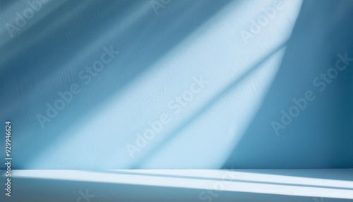 Wallpaper Mural Empty room minimalistic light blue background for product presentation with shadow and light from windows Torontodigital.ca