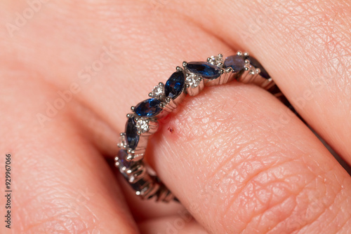 Картината върху платно Macro shot of a jewel ring on a female hand.