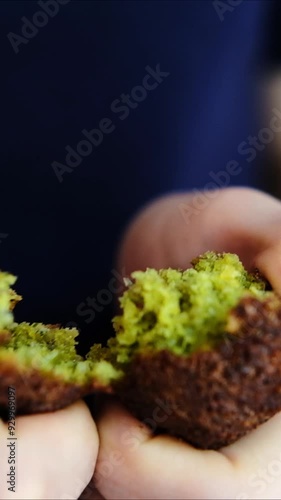 Fresh fried falafel in section. Softness of falafel. 4k video, close angle,  vertical video