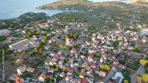 The church as a central point of a recognizable village on the island of Solta, Grohote photo