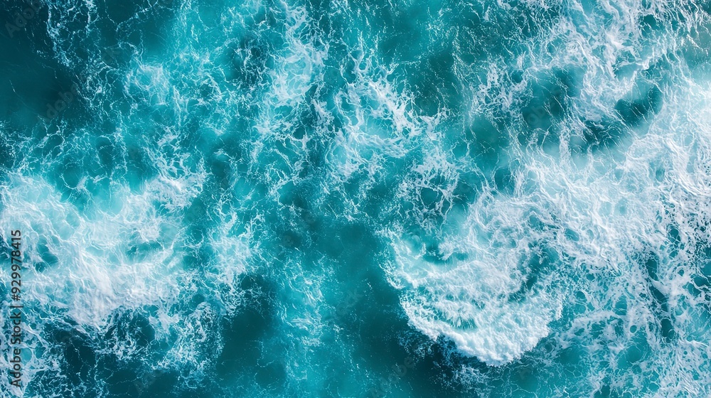 aerial view of turquoise ocean water with splashes and foam for abstract natural background and texture